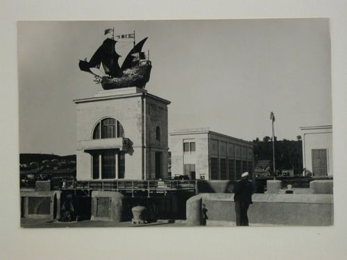 Exterior view of the Moscow-Volga Canal Pumping-station with a modern building surmounted by a replica of a sailing ship in the foreground, Moscow