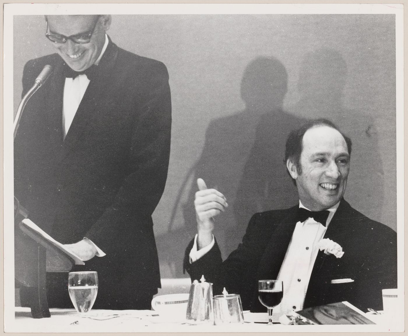 Parkin giving speech next to Prime Minister Pierre Elliot Trudeau at dinner event