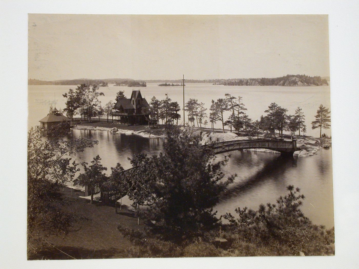 View of woodbridge and Gothic Revival House with two-tiered, wraparound porch, at the Thousand Islands, New York