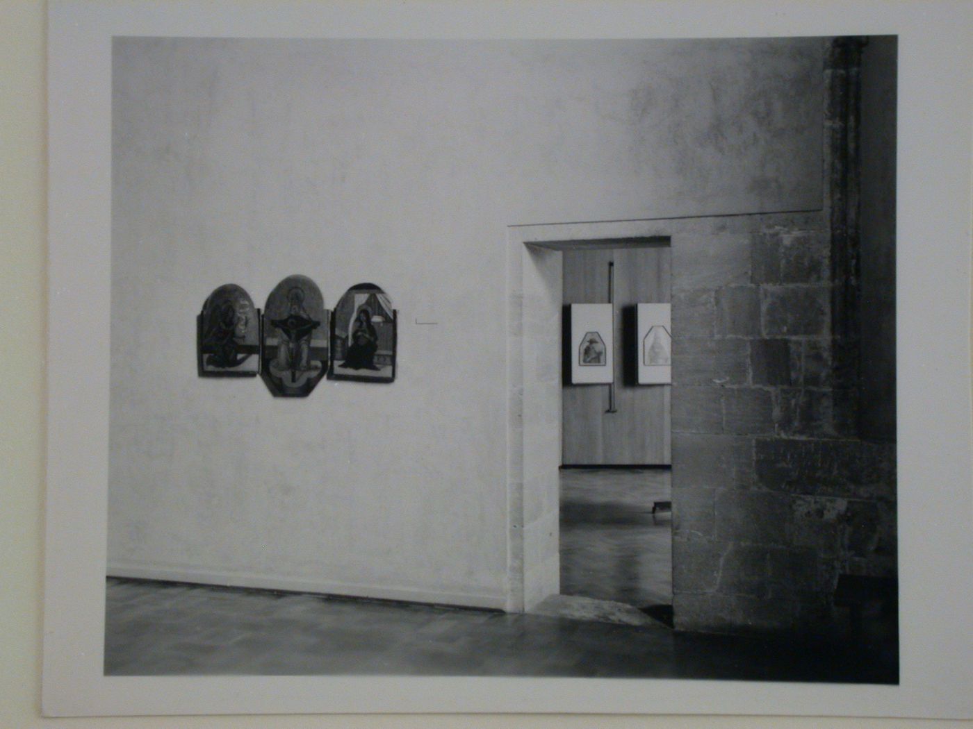 Interior view of a gallery showing a triptych painting, a doorway and another gallery, Palazzo Abatellis, Galleria regionale della Sicilia, Palermo, Italy
