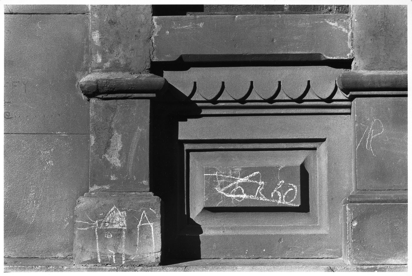 Close-up view of the façade of a building showing chalk graffiti, New York City, New York