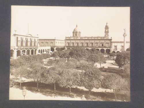 View of the Plaza de Armas showing the dome and tower of the Iglesia del Carmen and on the left, the Columna de la Independencia, Celaya, Mexico