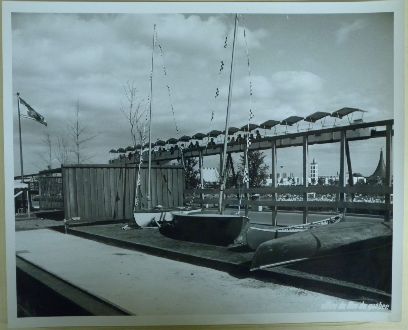 View of canoes and sailboats with the minirail in background, Expo 67, Montréal, Québec