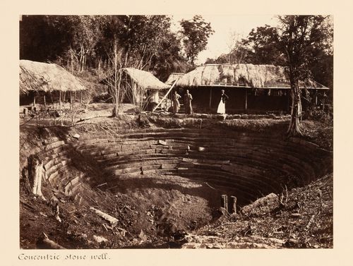 View of a water well with huts in the background, Anuradhapura, Ceylon (now Sri Lanka)
