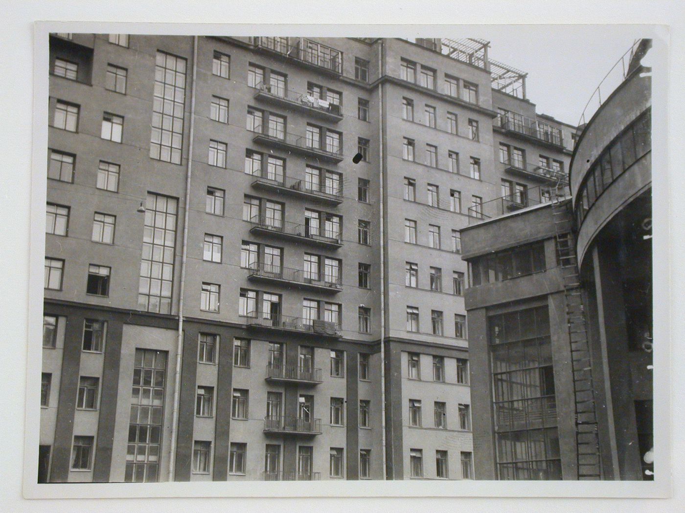 View of a courtyard of VTsIK residential complex showing the club-theater on the right, Moscow