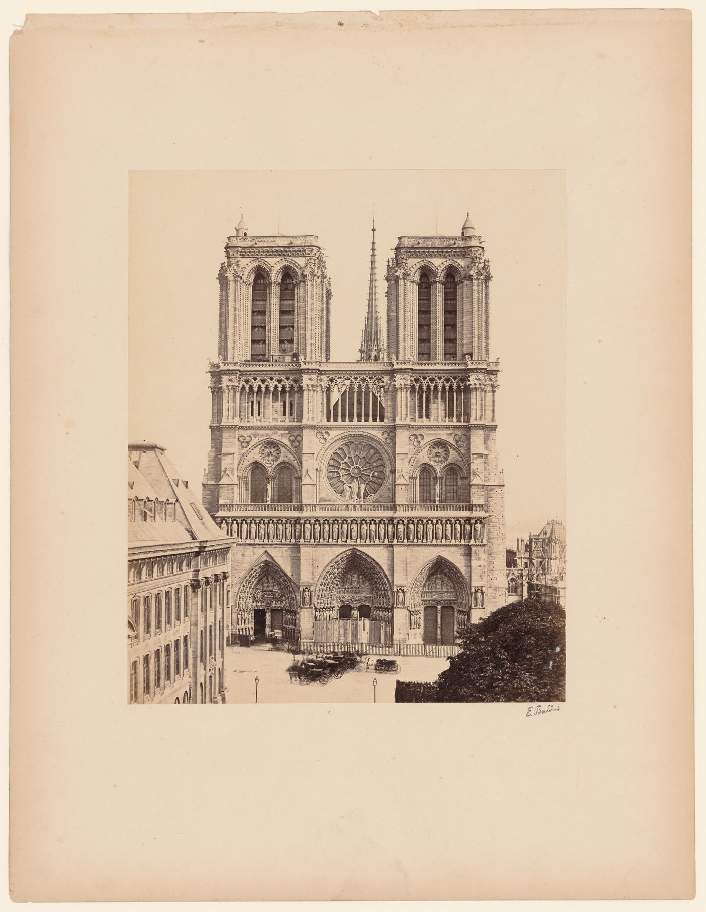 Exterior view of façade and towers (including crossing spire) of Notre-Dame, Paris, France