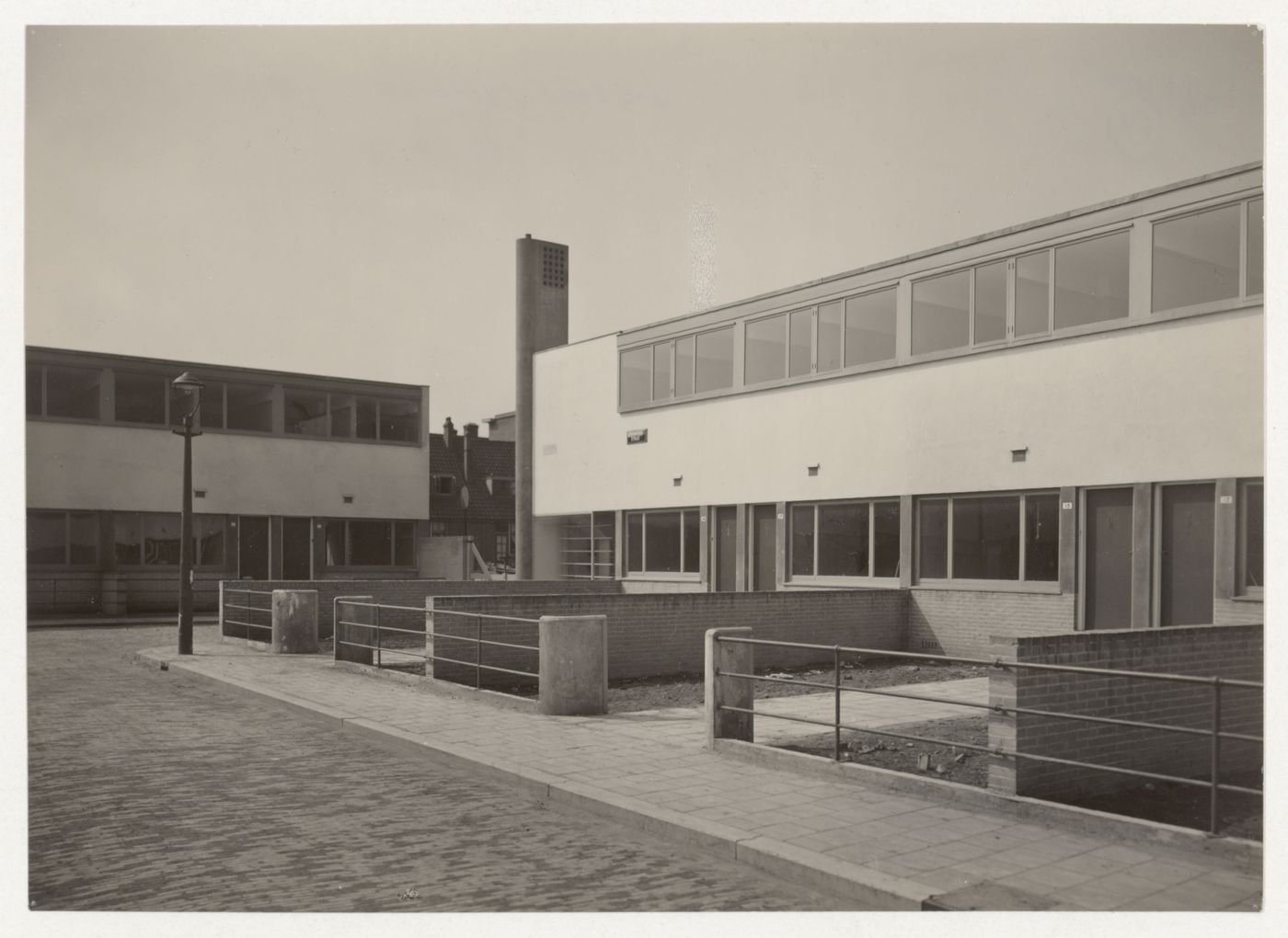 View of the principal façade of Kiefhoek Housing Estate showing a smokestack, Rotterdam, Netherlands