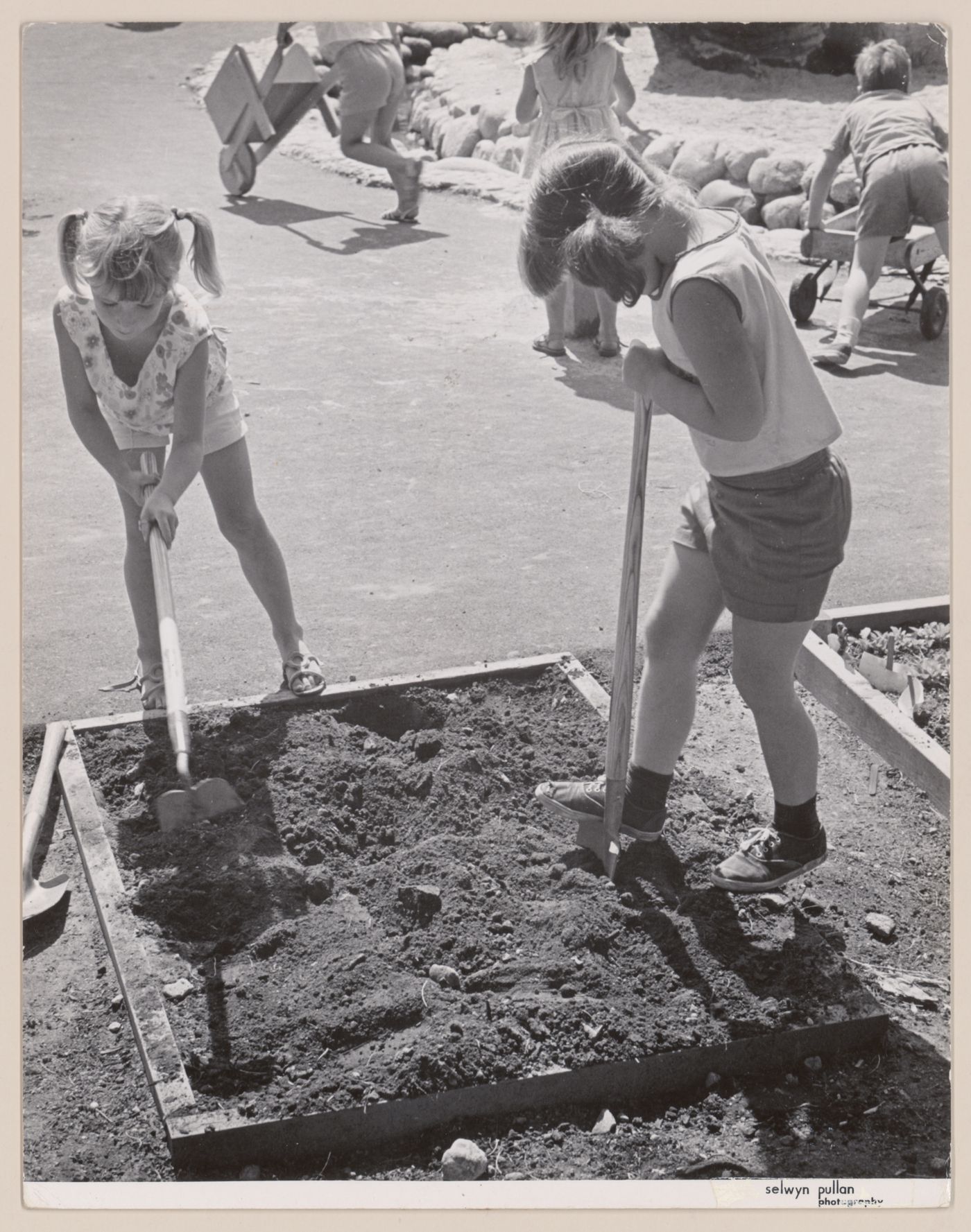 View of children playing in North Shore Neighbourhood House Playground, Vancouver, British Columbia