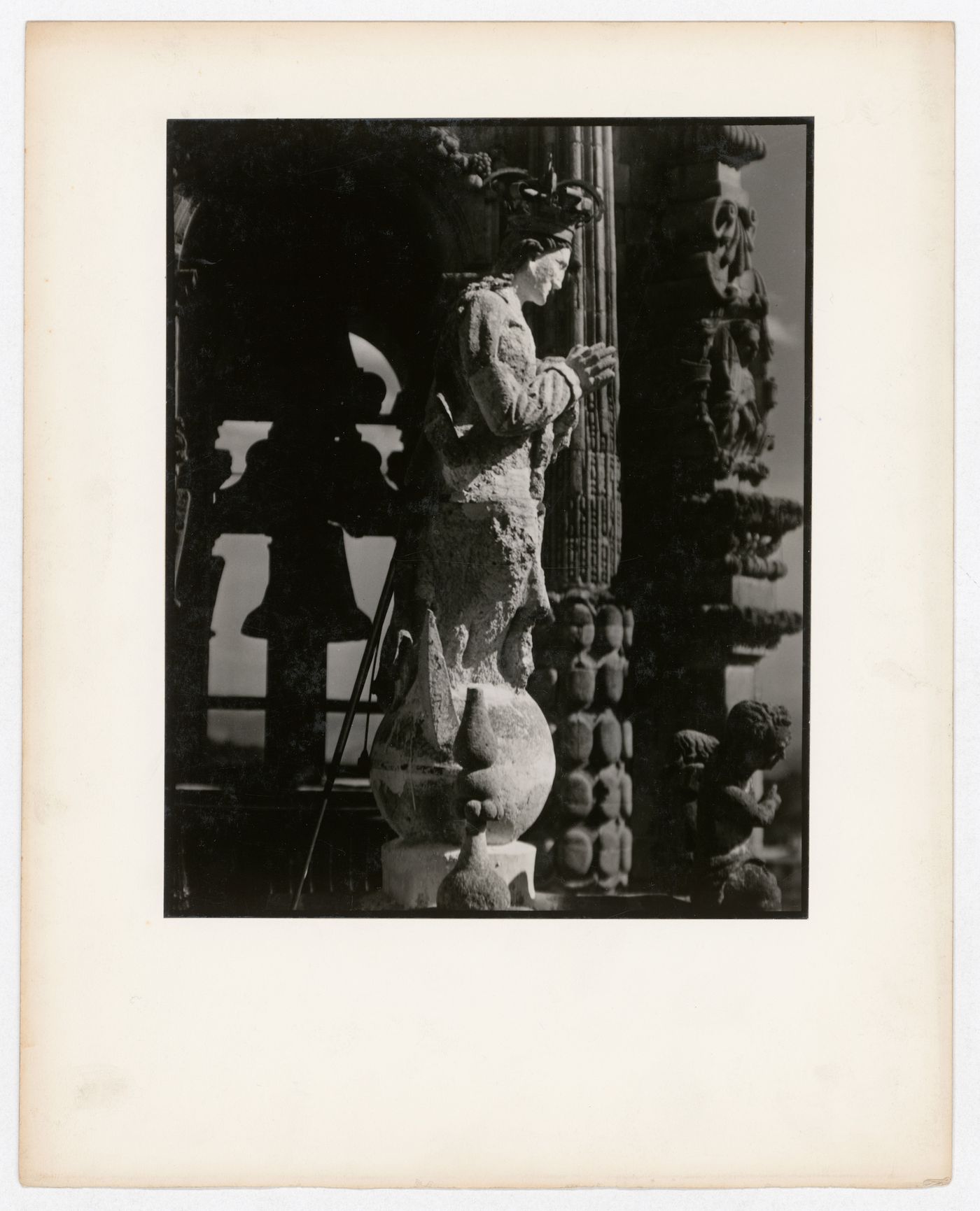 View of a statue with a bell tower in the background, Santa Prisca, Taxco de Alarcón, Mexico
