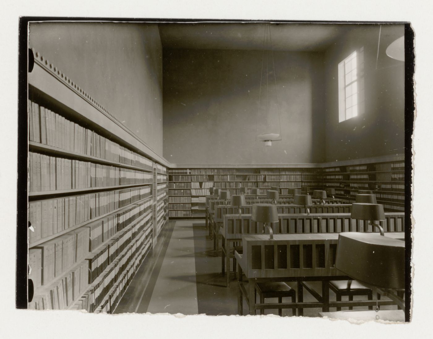 Interior view of a reading room of Stockholm Public Library showing bookshelves and carrels, 51-55 Odengatan, Stockholm