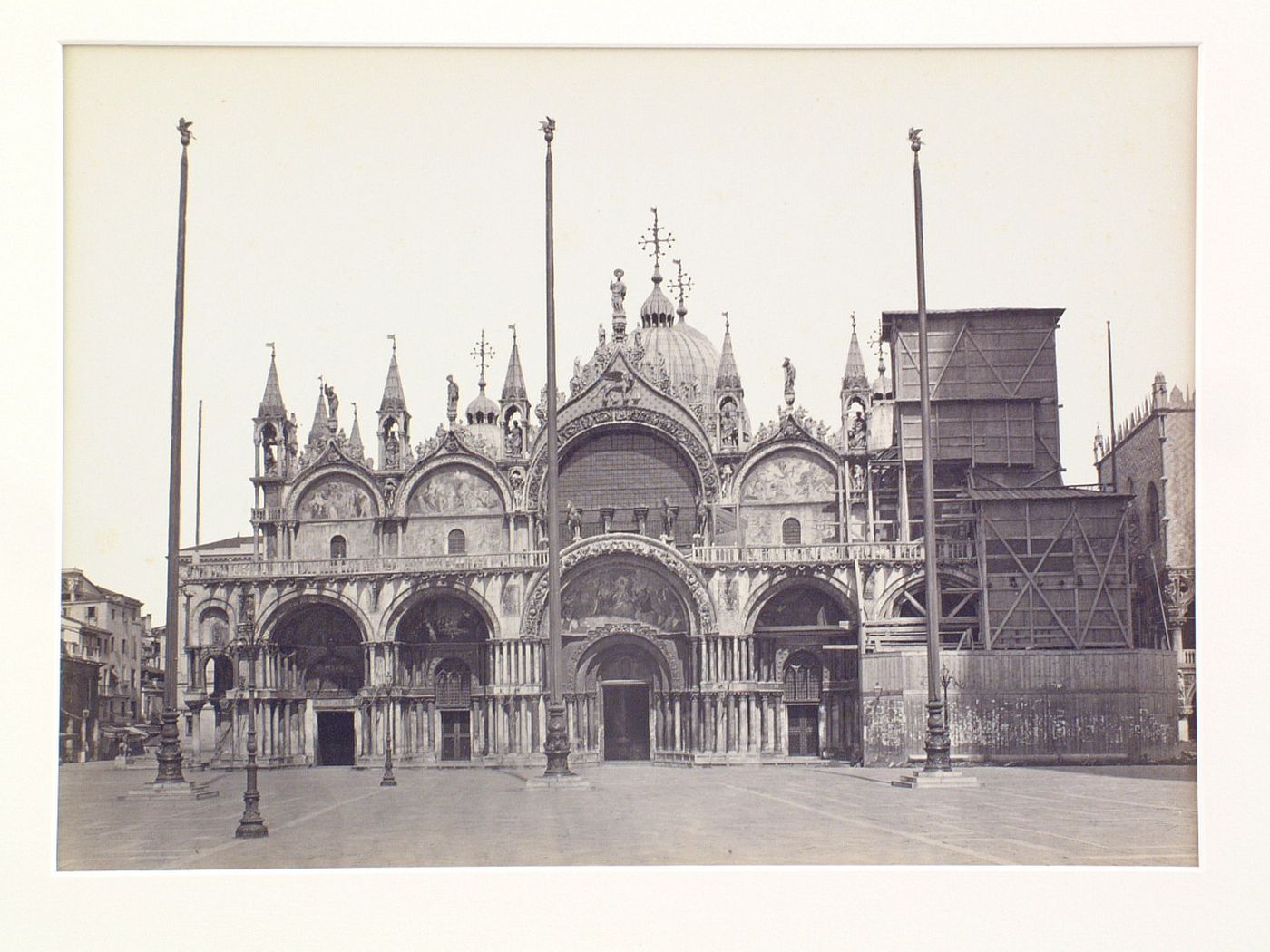 St. Mark's cathedral, façade with tower at R under repair, Venice, Italy