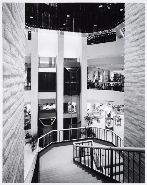 Interior view of the Bullock's Wilshire department store at the Promenade shopping mall showing stairs and elevators in the Garden Court, Woodland Hills, Los Angeles, California
