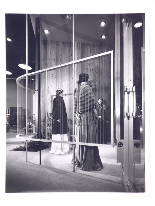 Interior view of Ohrbach's store with mannequins wearing fur coats and wraps, Prudential Square, Los Angeles, California, United States