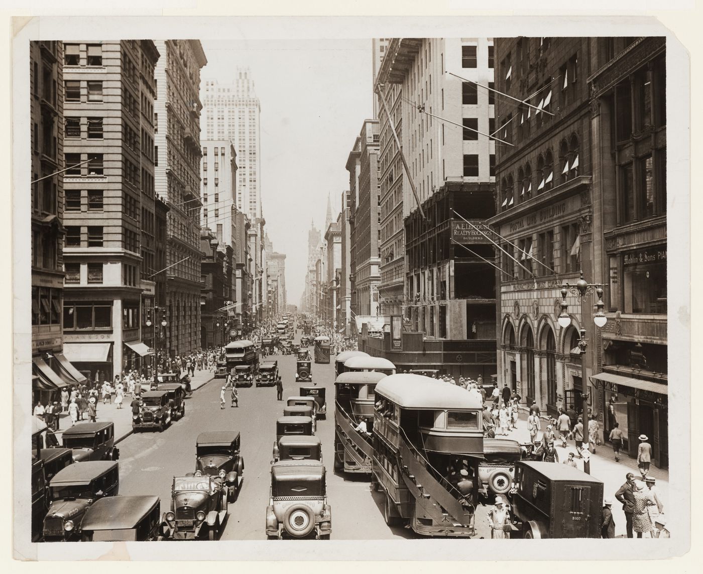Fifth Avenue at 43rd Street with buses in foreground looking up?, New York City, New York