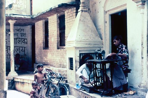 View of street in India with a tailor at work for the Human Settlement Training Package "Package 1: Planning guidelines"