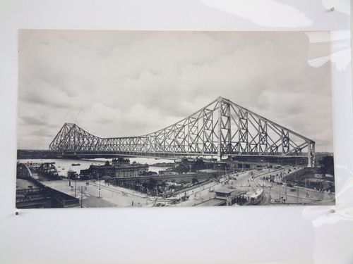View of Kolkata tram and the Howrah Bridge over the Hooghly River, West Bengal, India