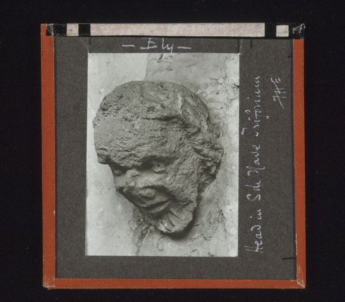 View of sculpture of head in triforium on south side of nave of Ely Cathedral, Ely, Cambridgeshire, England