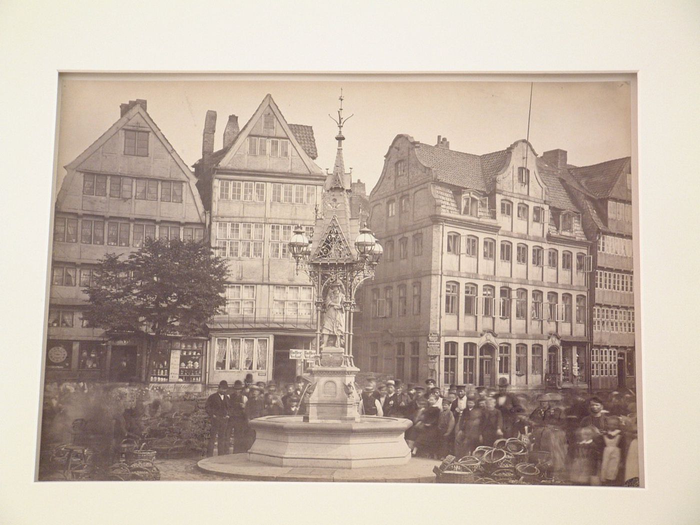 View of fountain and crowd of people in a square, Hamburg, Germany