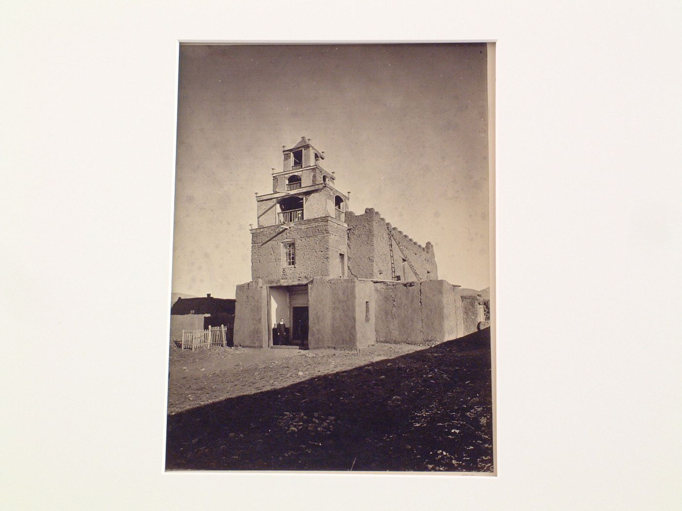 View of the Church of San Miguel with a priest in the doorway, Santa Fe, New Mexico, United States