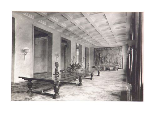 Interior, view of long room with long table, tapestry on wall at end