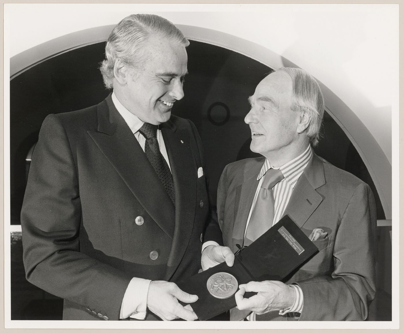 Photograph of Parkin presenting Henry Moore with the Royal Canadian Academy Medal at the Art Gallery of Ontario