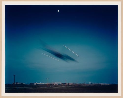 ORD: O’Hare Airfield:  View of Aircraft landing at dusk on runway 14R, O'Hare International Airport, Chicago, Illinois