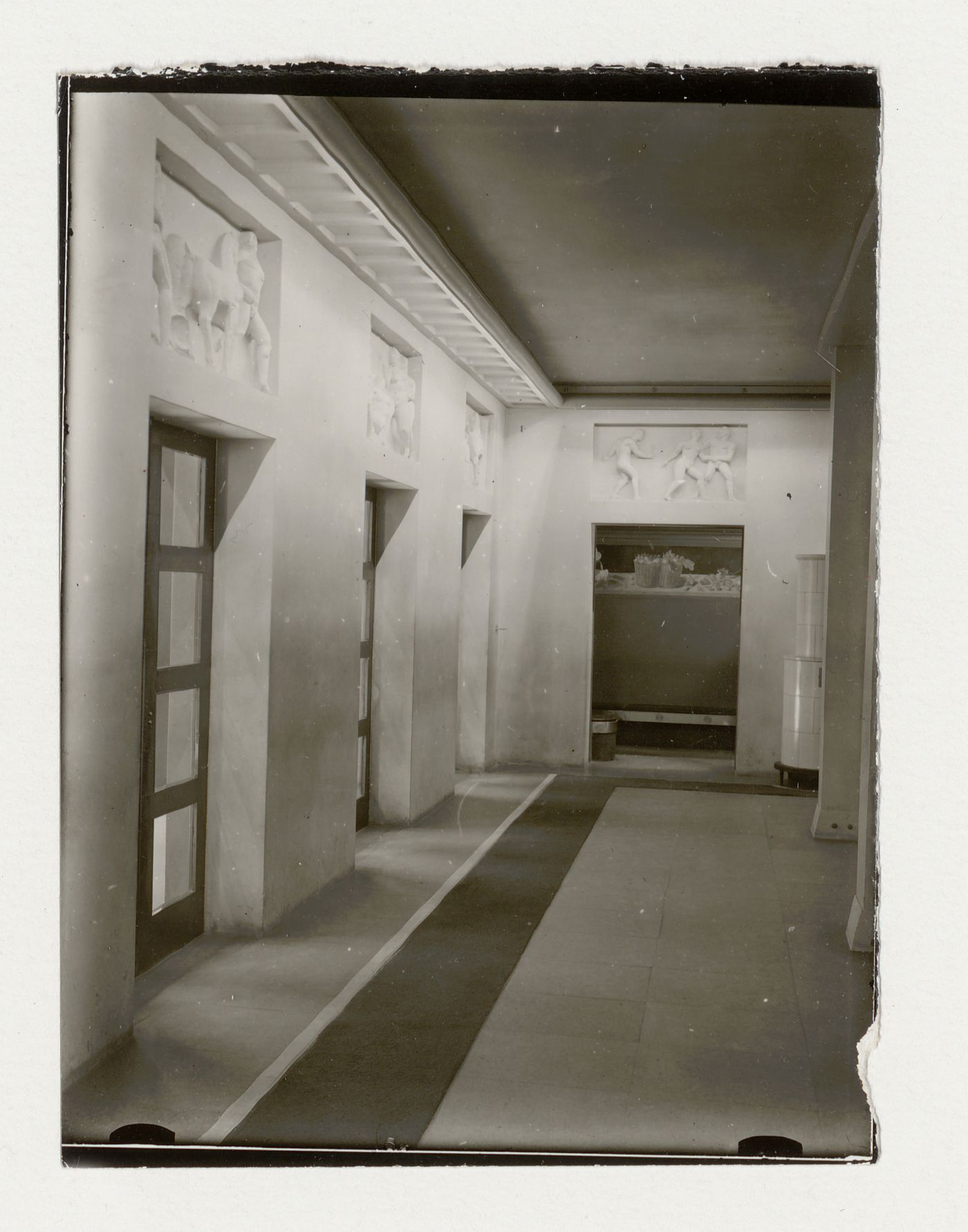 Interior view of the vestibule of Skandia Cinema showing the entrance doors and the wall reliefs designed by Stig Blomberg, Stockholm