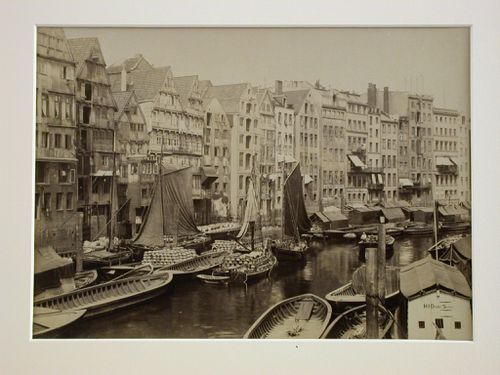View of a narrow canal, crowded with boats, with houses on one side, Hamburg, Germany