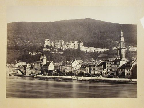 View across river of city, with church on right and castle [?] on hill behind city, Heidelberg [?], Germany