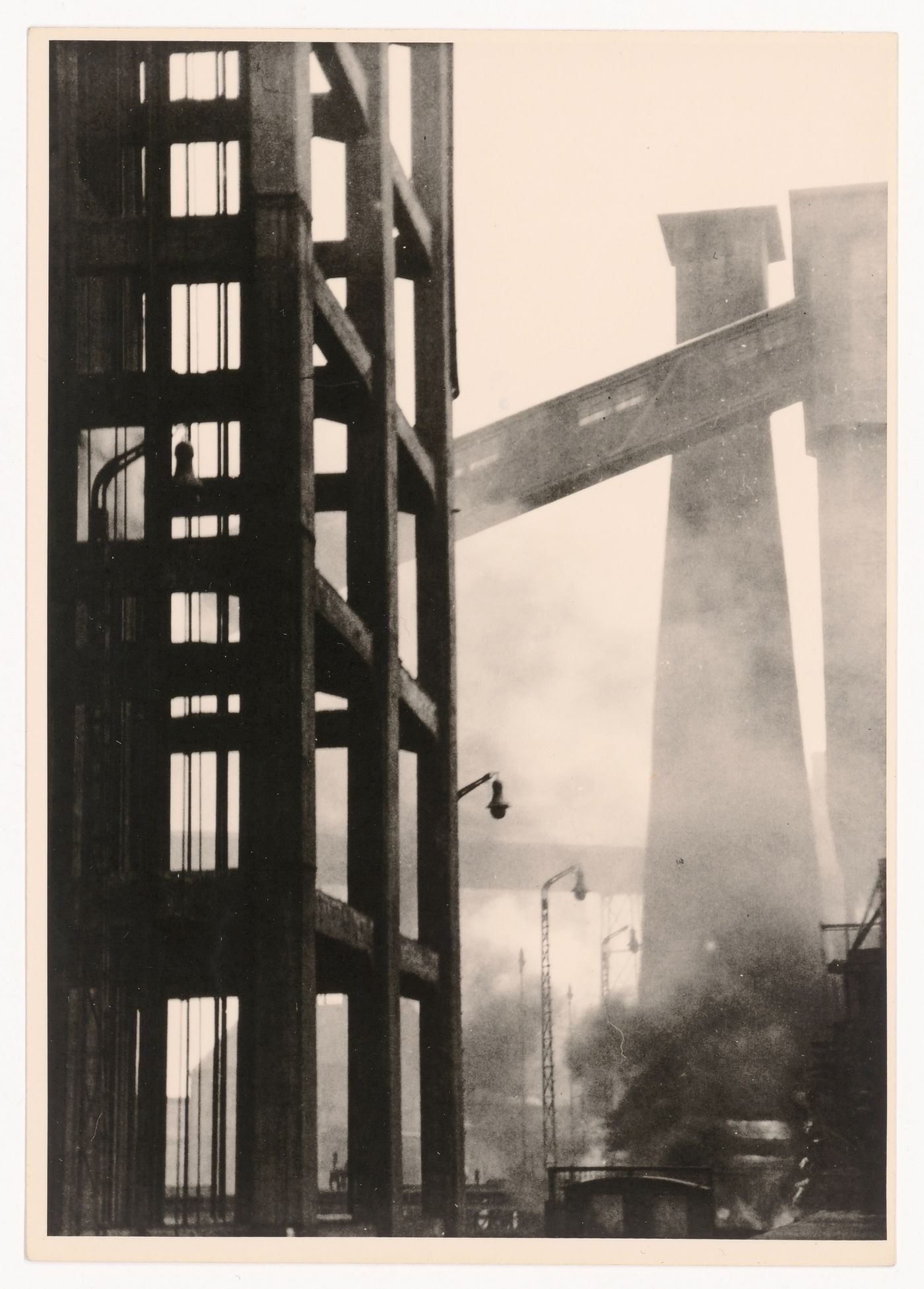 Tall, smoking factory chimneys and scaffolding, Ruhr, Germany