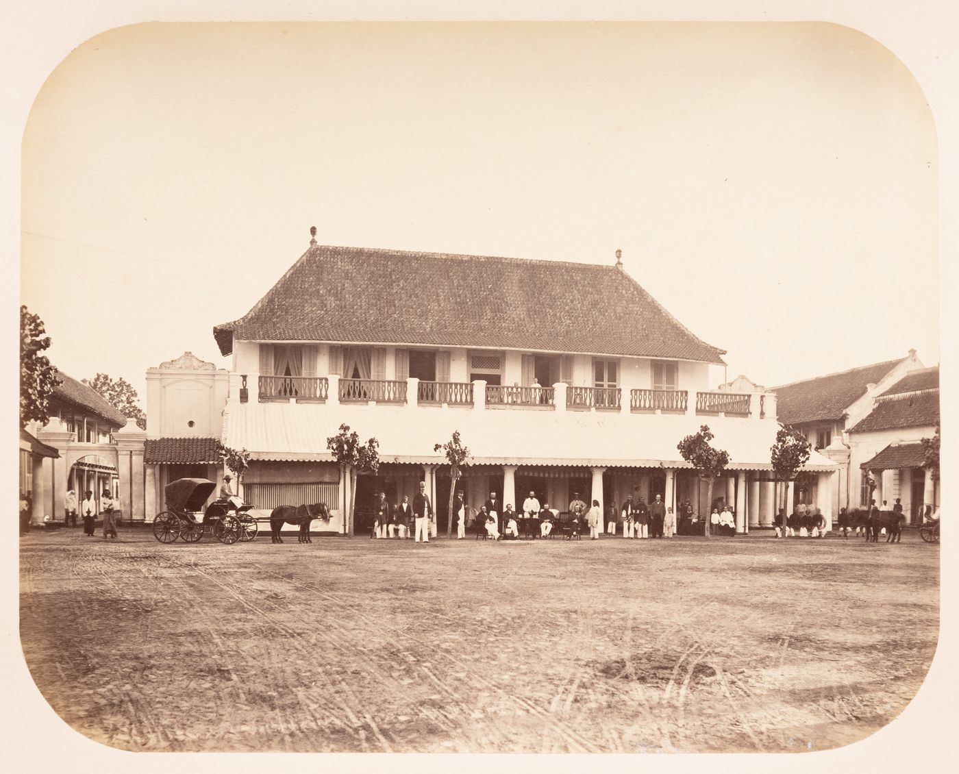 View of buildings and a square showing a carriage and people, Semarang, Dutch East Indies (now Indonesia)