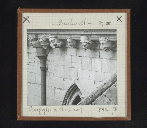 Detail view of sculptures of grotesque heads on choir roof, Southwell Minster, Southwell, Nottinghamshire, England