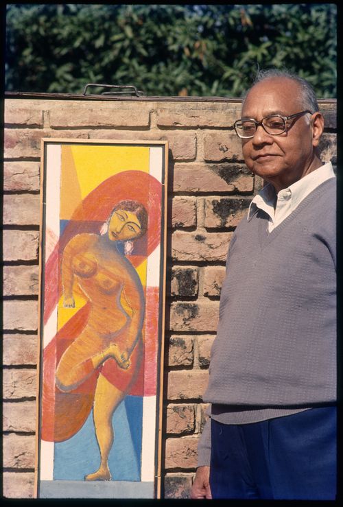 Slide of Aditya Prakash next to one of his paintings
