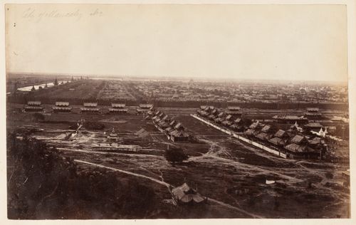View of Mandalay showing the city wall, moat, and buildings, from Mandalay Hill, Burma (now Myanmar)