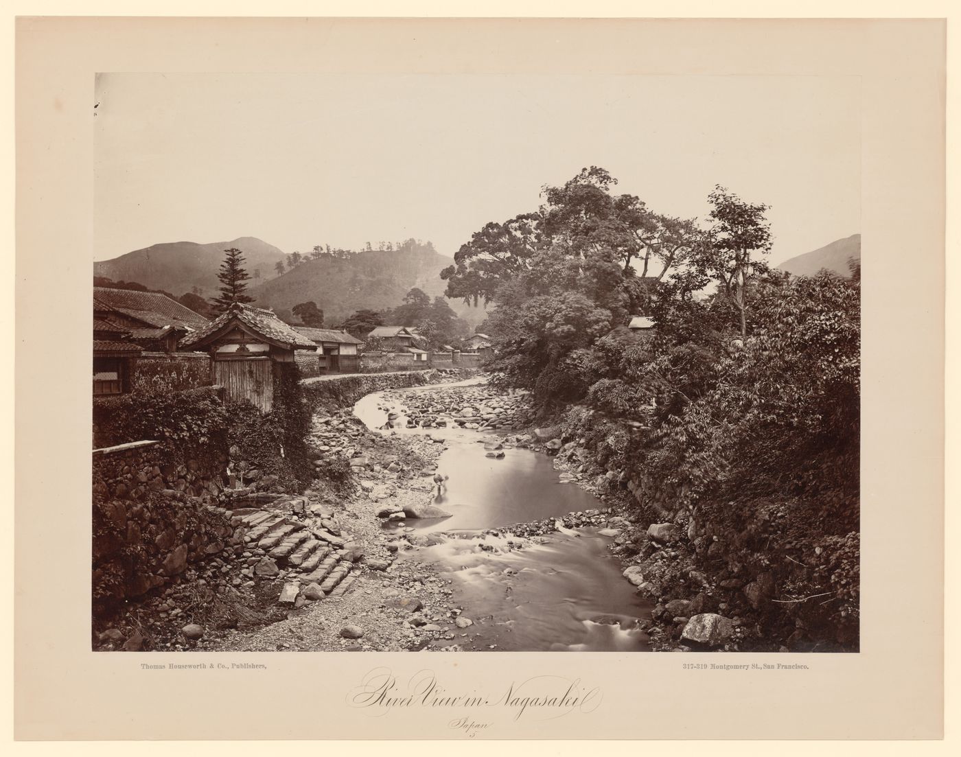 View of the Nakashima River showing houses, Nagasaki, Japan