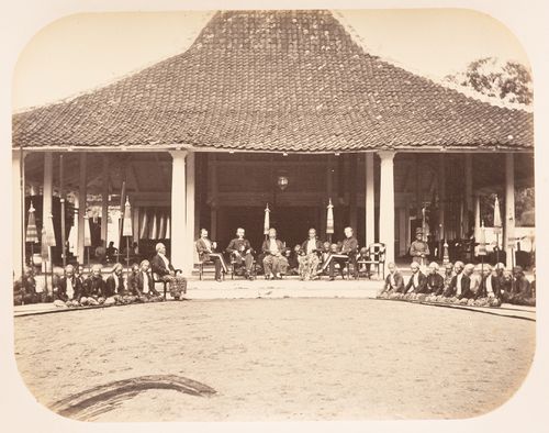 Group portrait of men posing in front of the residence of the Regent of Tegal, Tegal, Dutch East Indies (now Indonesia)