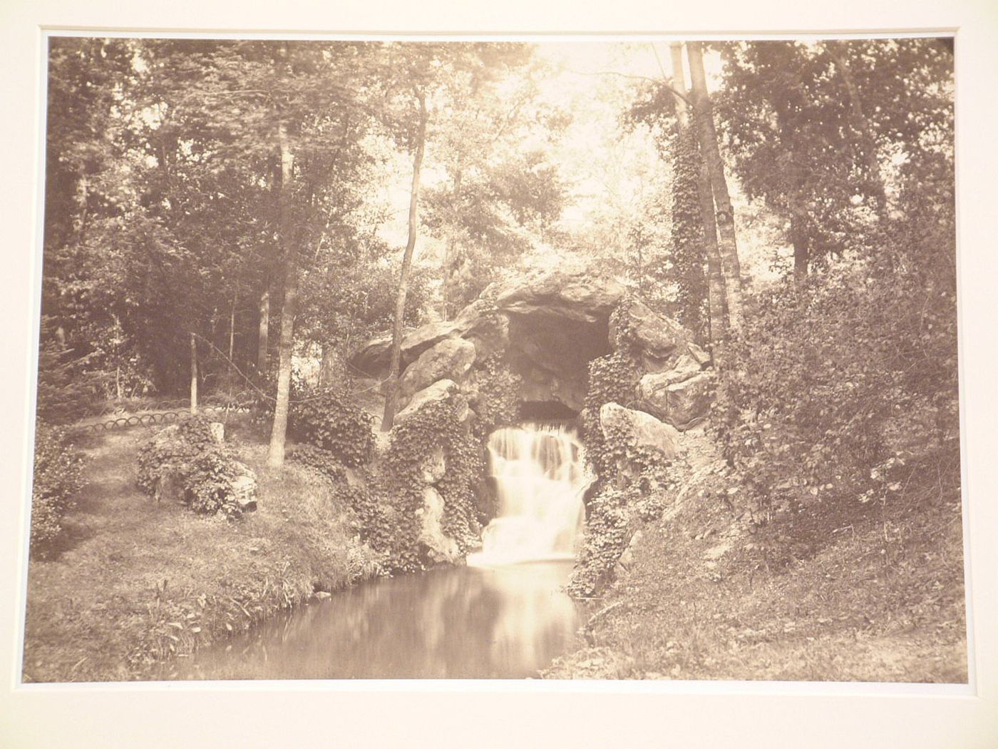 View of la petite grotte, vers la "Mare aux 1 biches", Bois de Boulogne, Paris, France