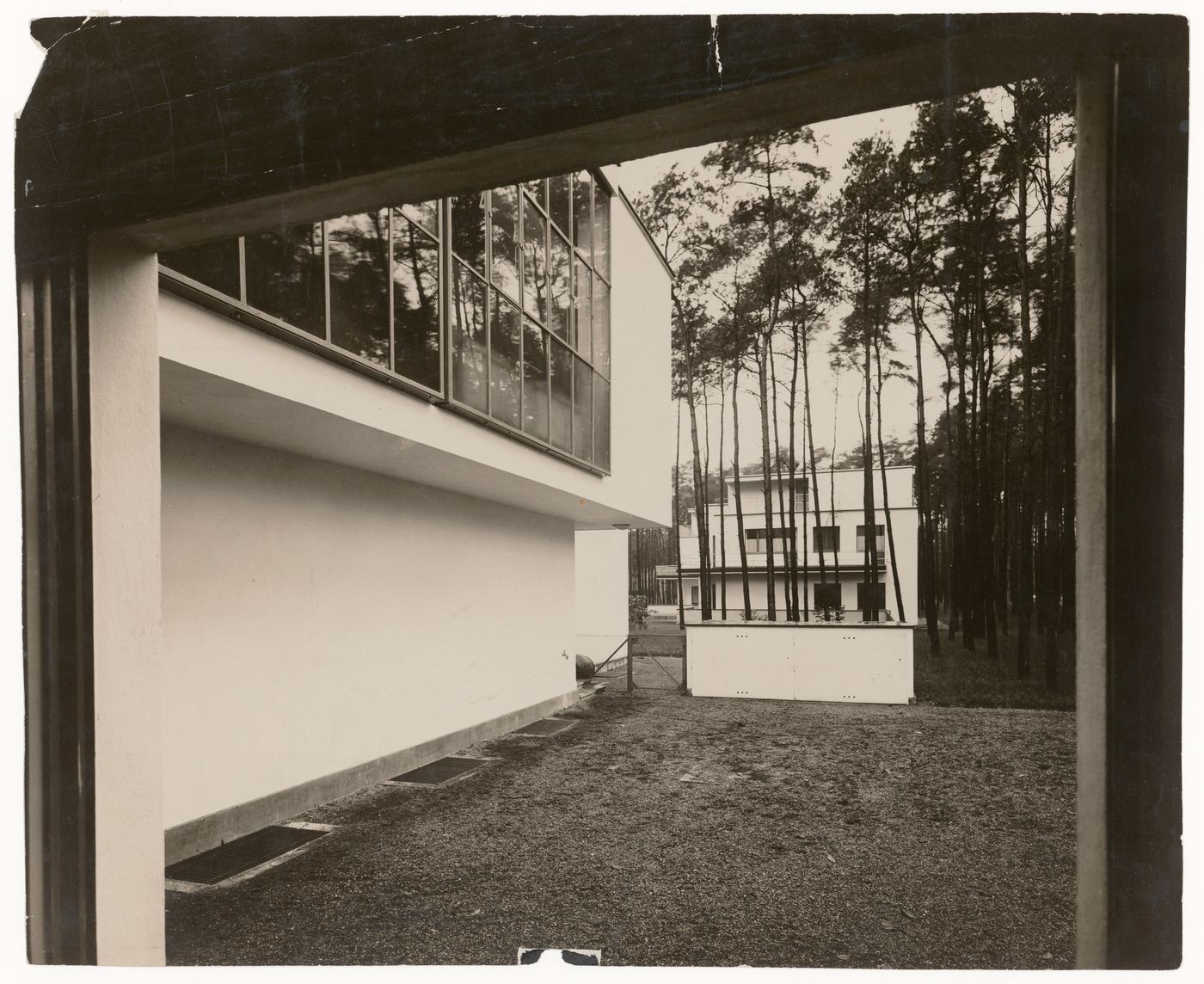 Exterior view of the Bauhaus Masters' Housing through Lucia Moholy's studio window, Dessau, Germany