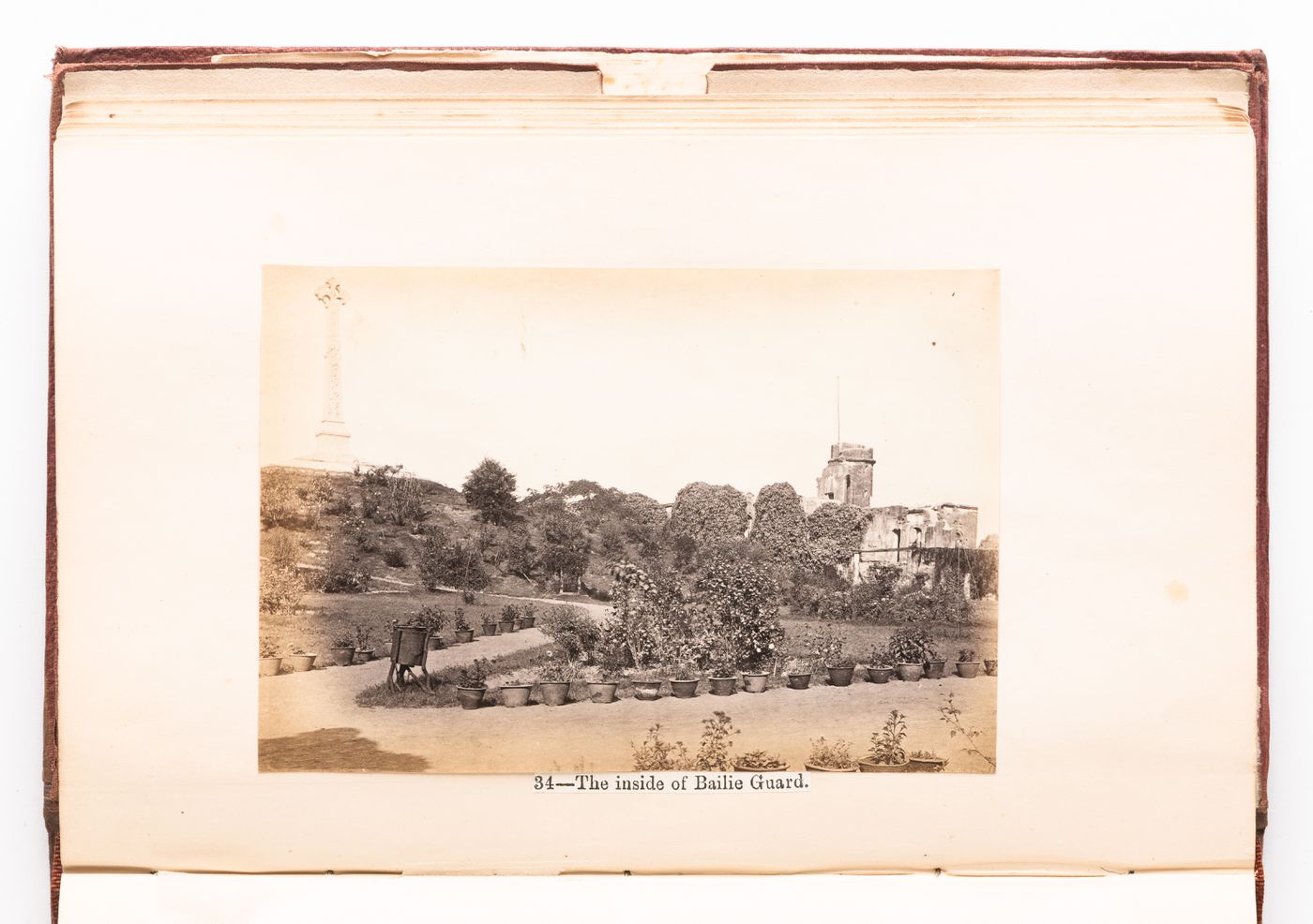 View of the Residency Complex from the Baillie Guard gateway with the monument to the victims of the Indian Mutiny of 1857 in the background, Lucknow, India