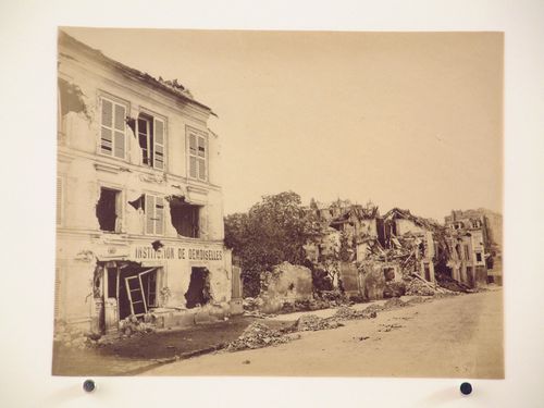 View of a street showing a girls' school on the left after the Paris Commune uprising of 1871, Paris, France