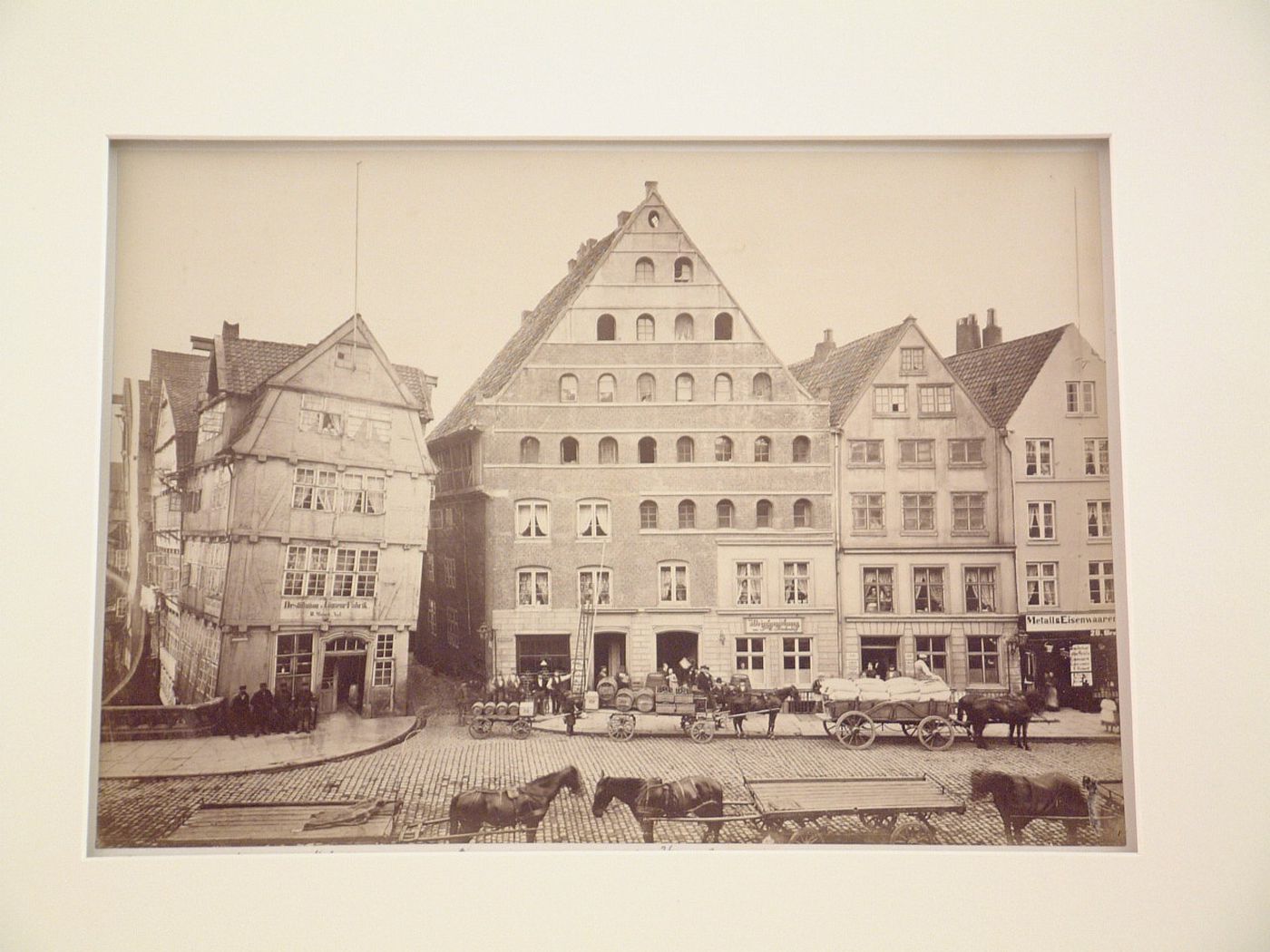 Houses and horses drawn carts on Braves street, Hamburg, Germany