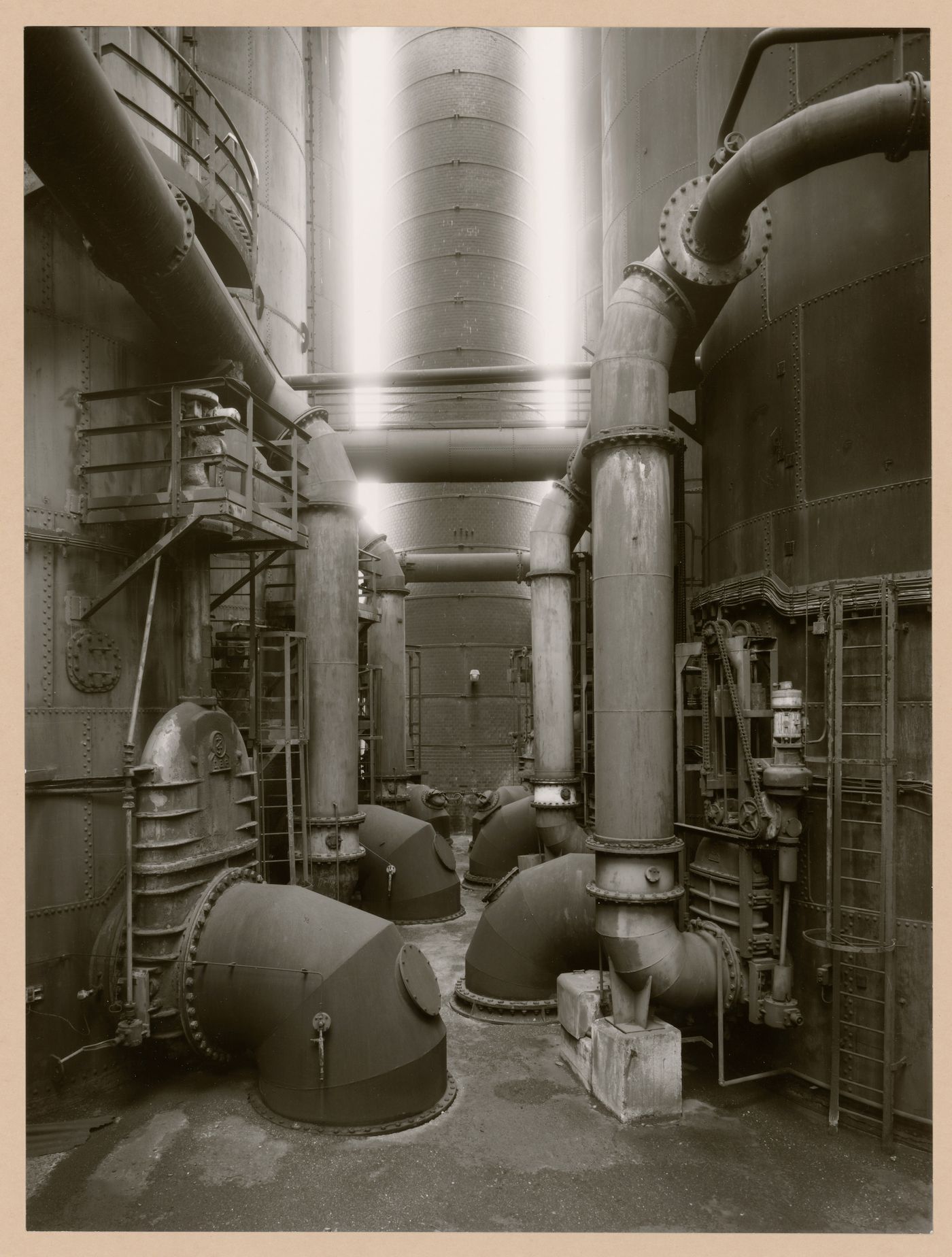 Interior view of Metallhüttenwerk industrial plant showing hot blast stoves and a chimney, Lübeck-Herrenwyk, Germany