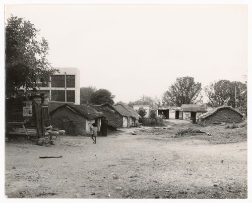 View of newly constructed hotel with pre-existing rural dwellings, Sector 12, Chandigarh, India
