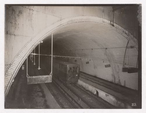 Construction of the Paris Metro, interior view of St. Michel Metro station with a train, Paris, France