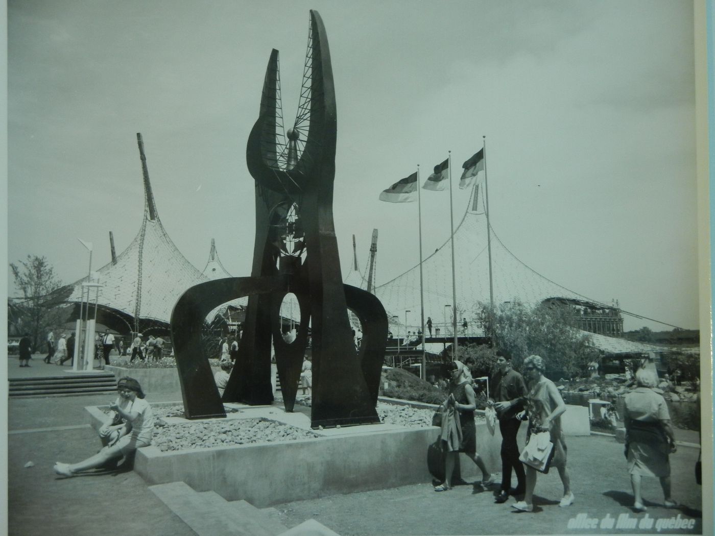View of the sculpture 'Transcendence' by Walter Führer with the German Pavilion in background, Expo 67, Montréal, Québec