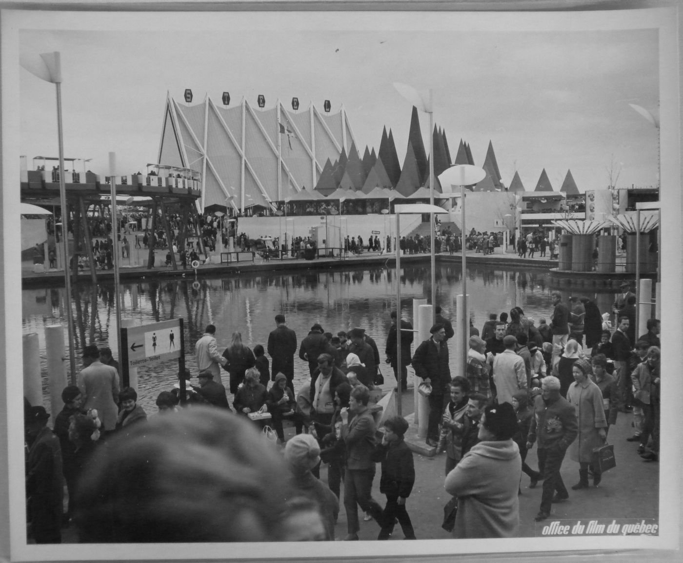 View of a waterway next to the Steel and Canadian Pulp and Paper Pavilions, Expo 67, Montréal, Québec