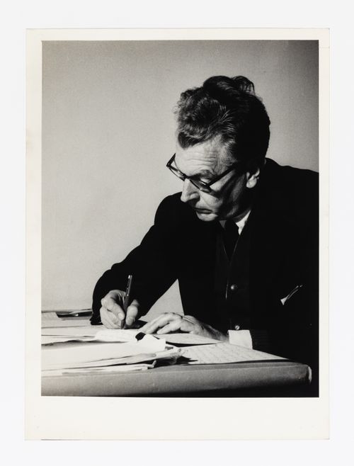 Photograph of Amancio Wiliams writing letters