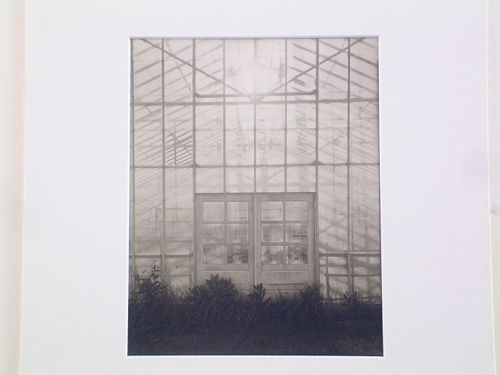 Exterior view of wall and entrance doors of a large greenhouse, from the series Greenhouse