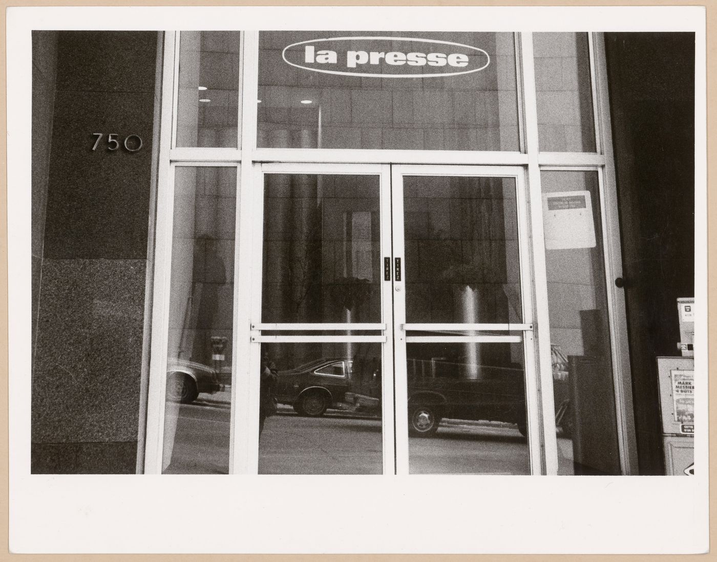 Exterior view of doors of La Presse at 750 Boulevard Saint-Laurent, Montréal, Quebec