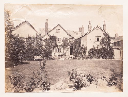 View of three consecutive dwellings with a lawn in the foreground, Europe ?